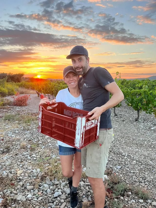 Couple at sunset with harvest crate